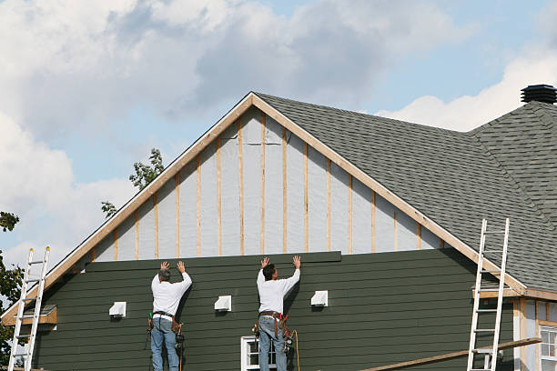 Professional Storm Damage Siding Repair technician working in Bairdford, PA